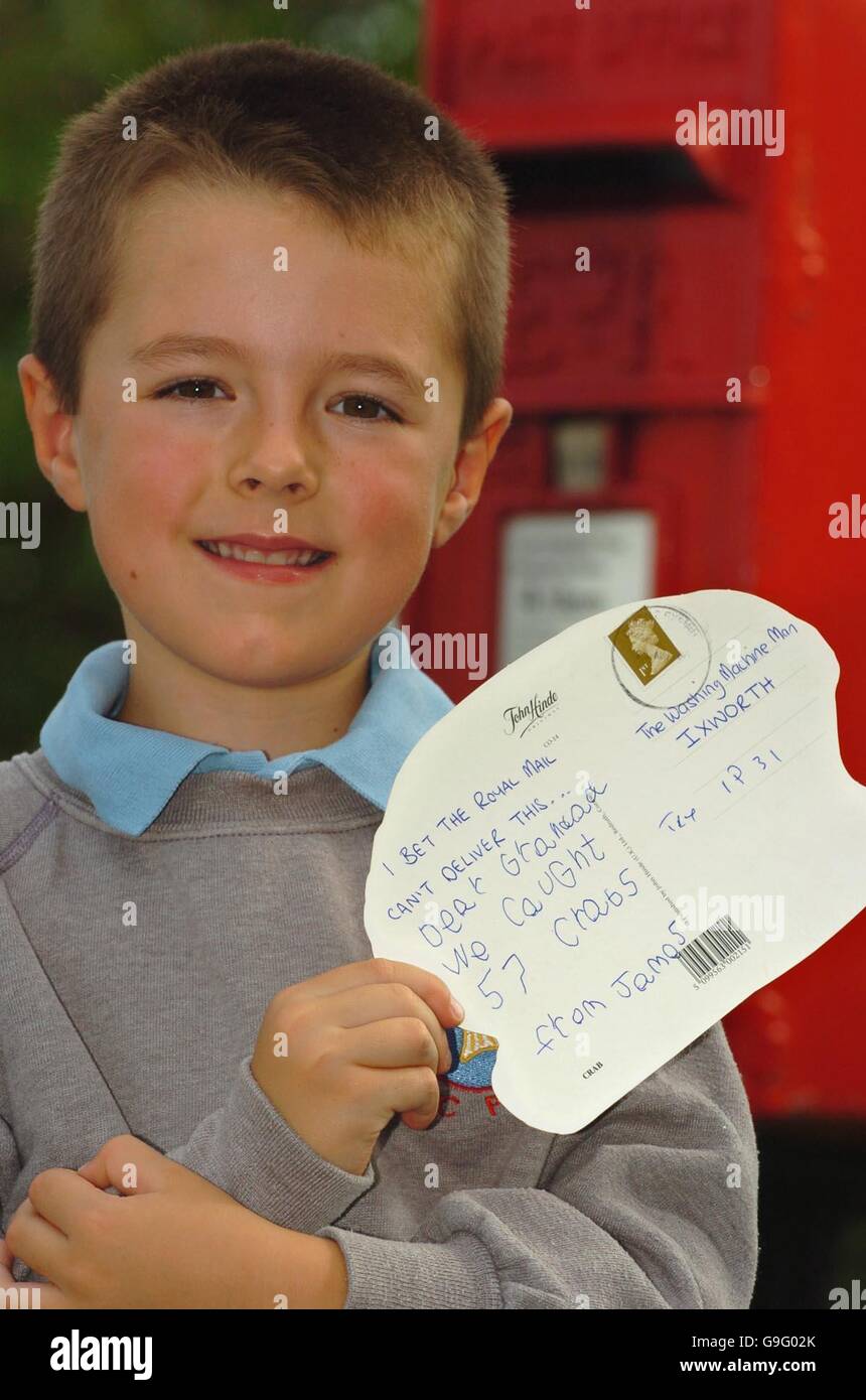 James Tungate, 6, from Thurston, Suffolk, holds a postcard addressed to The Washing Machine Man, Ixworth. The youngster sent the card to his grandfather whilst on holiday in Cornwall and postworkers were congratulated today for delivering it successfully. Stock Photo