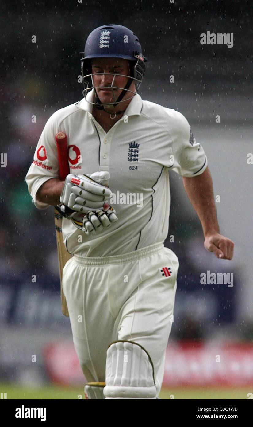 England captain Andrew Strauss returns to the pavillion as rain delays ...