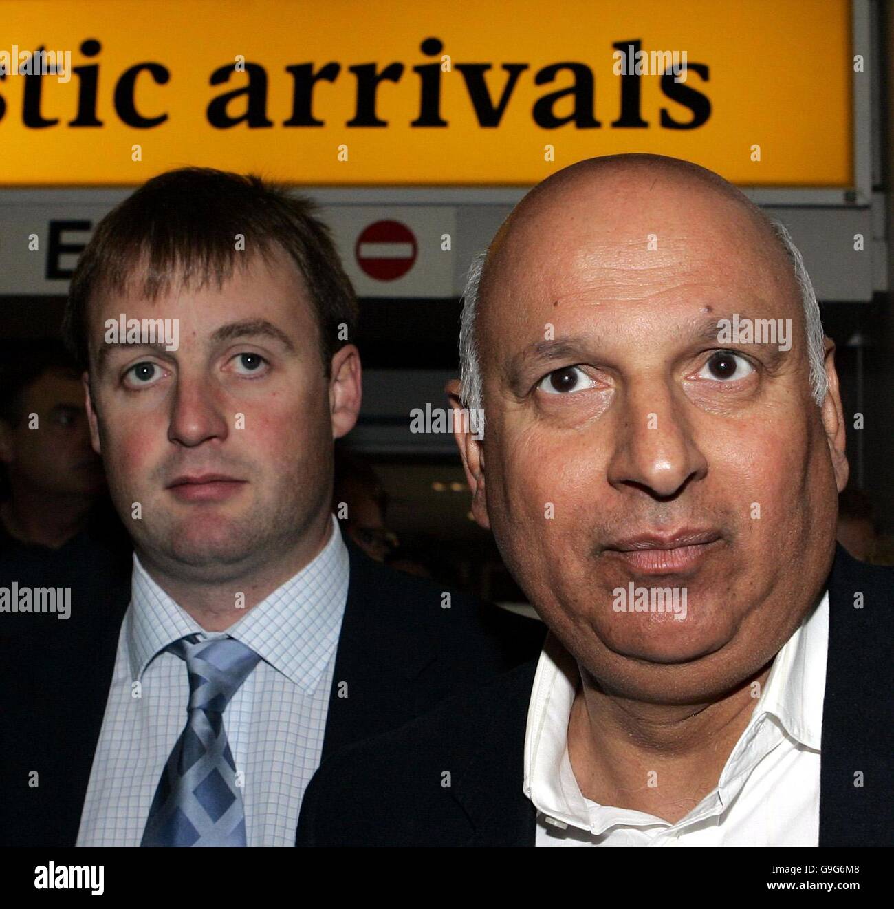 Labour MP Mohammed Sarwar (right) walks with Western Isles Labour MSP Alasdair Morrison on their arrival at Glasgow Airport, where they are to meet the mother of missing 12-year-old Molly Campbell before Mr Sarwar flies to Pakistan, where Molly is understood to have been taken by her sister and father. Stock Photo