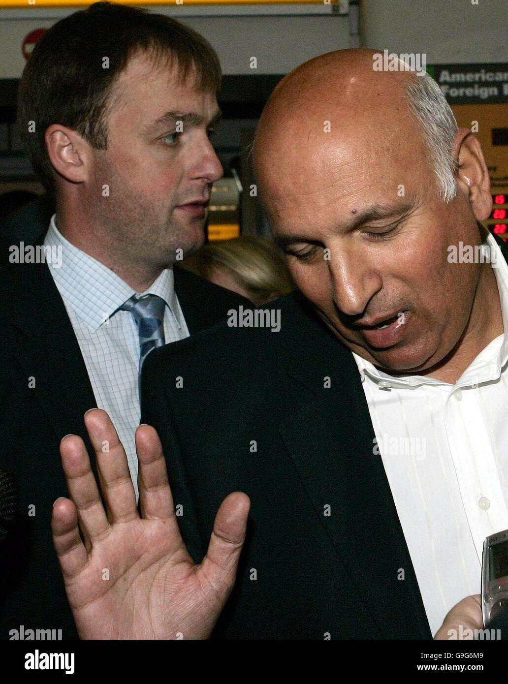 Labour MP Mohammed Sarwar (right) walks with Western Isles Labour MSP Alasdair Morrison on their arrival at Glasgow Airport, where they are to meet the mother of missing 12-year-old Molly Campbell before Mr Sarwar flies to Pakistan, where Molly is understood to have been taken by her sister and father. Stock Photo