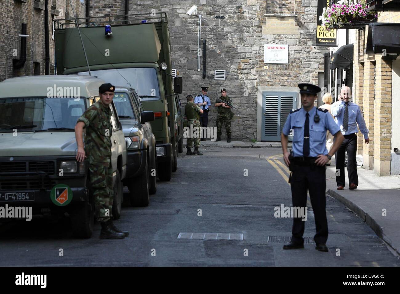Soldiers patrol the streets around the Mansion House in Dublin city centre while a special unit conducts a search for a suspect device. Stock Photo