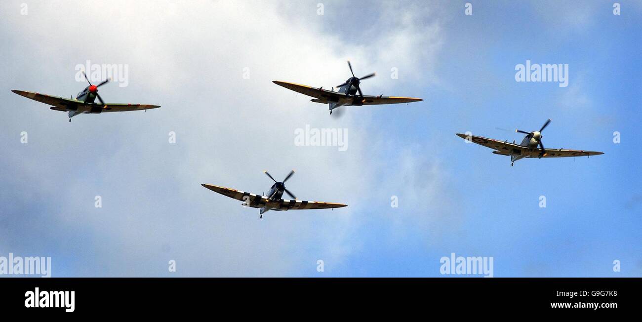 Spitfire show at Duxford. A group of four Supermarine Spitfires fly in formation above the Imperial War Museum airfield at Duxford. Stock Photo