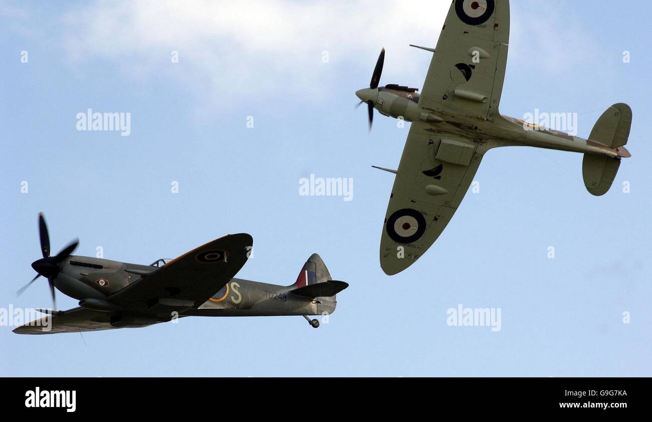 Spitfire show at Duxford. A group of eight Supermarine Spitfires fly above the Imperial War Museum airfield at Duxford. Stock Photo