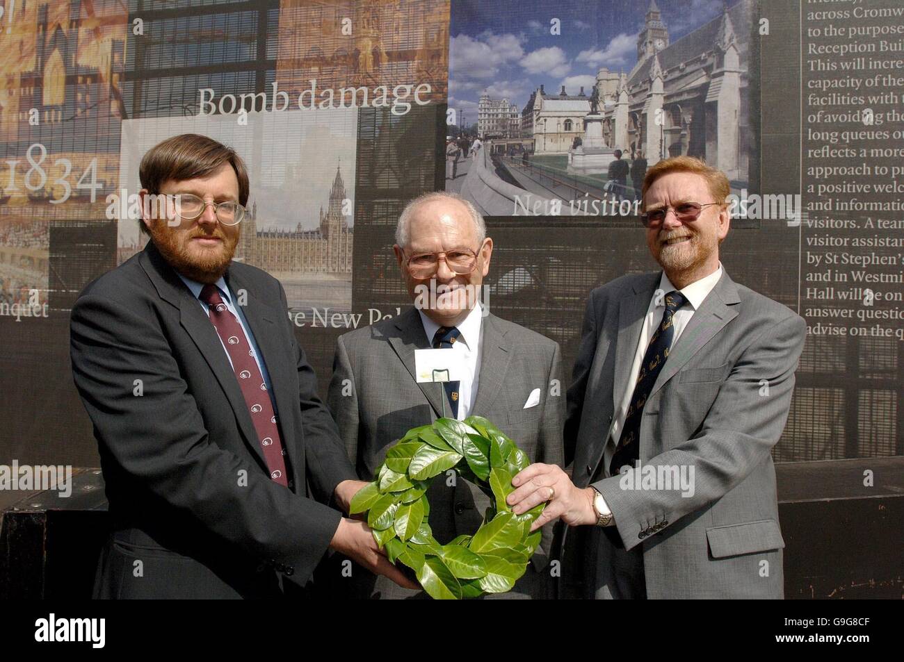 Dr Peter Gaunt (left), Edgar Samuel and Professor Barry Coward (right) hold a memorial wreath on behalf of the Cromwell Association, outside the Houses of Parliament in central London. The wreath is to be laid in the chapel at the Houses of Parliament to mark the anniversary of Oliver Cromwell's death. Stock Photo