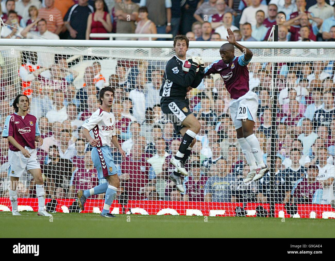 Nigel reo coker of west ham challenges aston villas thomas sorensen hi
