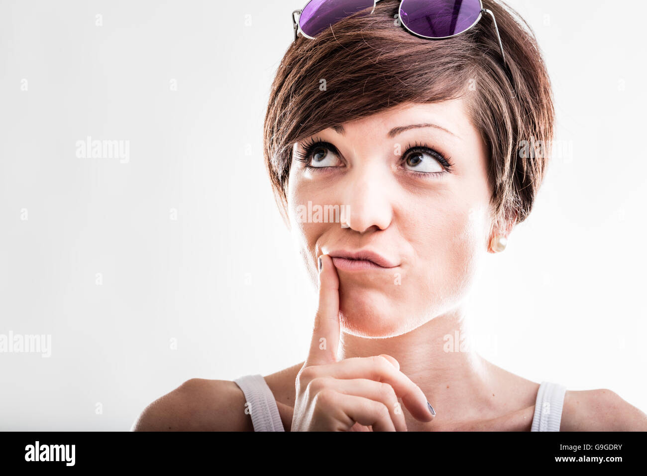 Woman finger chin looking up hi-res stock photography and images - Alamy