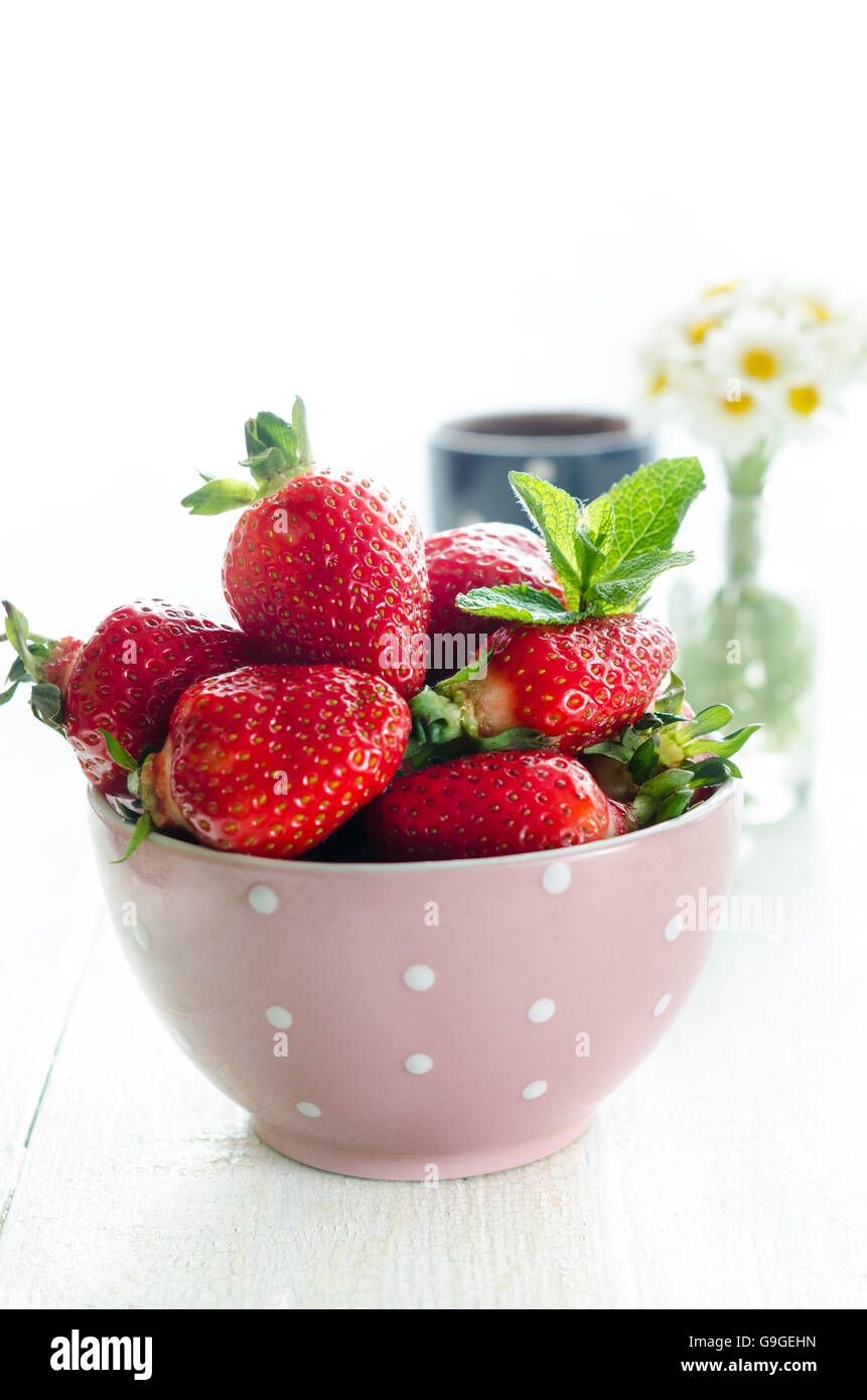 Bowl with strawberry, still life backlight photography Stock Photo