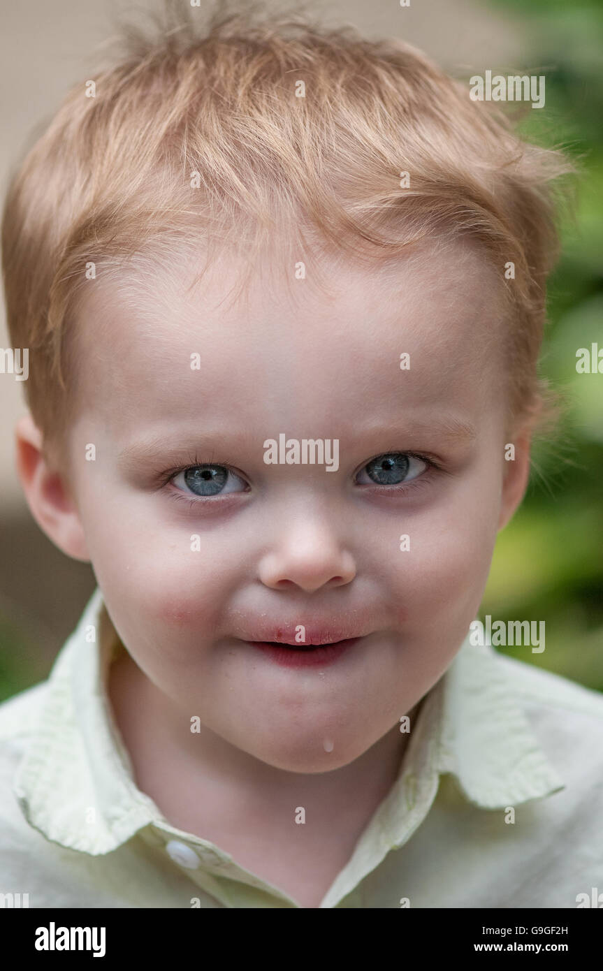 Mischievious look on a 3 year old. Stock Photo