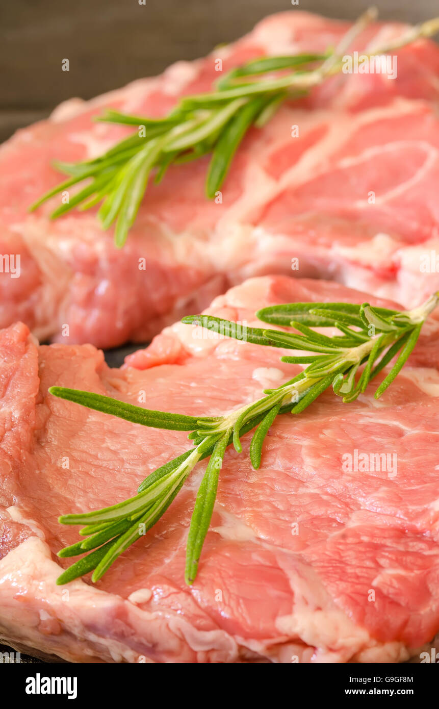 Raw steak with rosemary on castiron frying pan Stock Photo Alamy