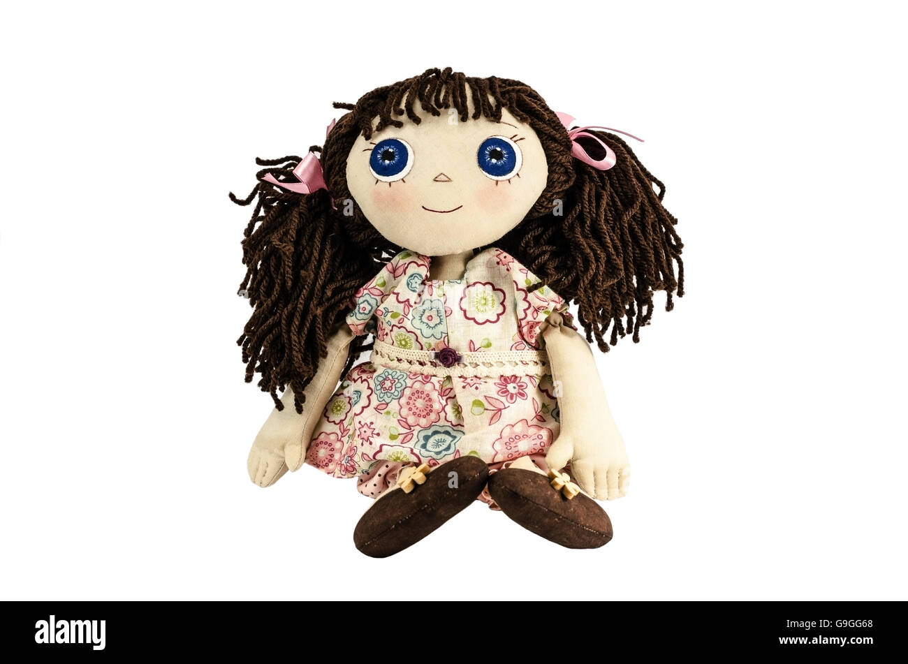 Doll with brown hair isolated on white Stock Photo