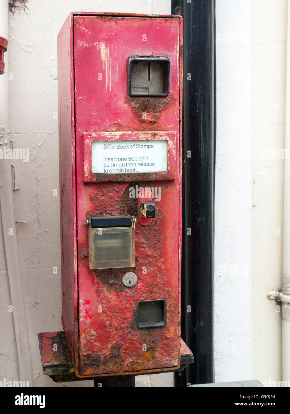 Old and rusty postage stamp vending machine UK Stock Photo Alamy