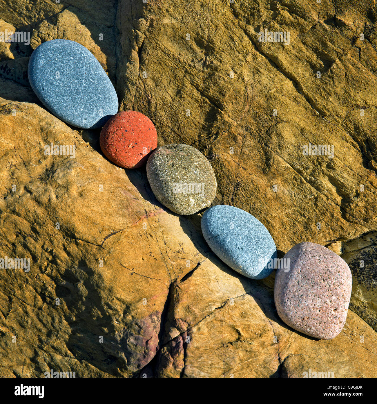 Geology showing some of the colourful rocks at Church Bay beach on the ...