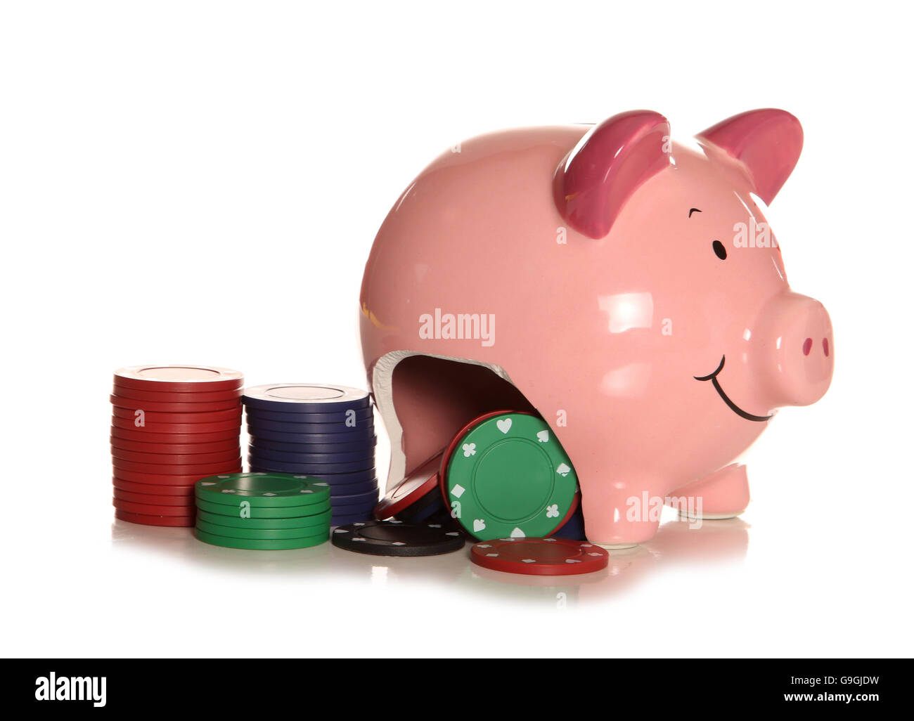 Spending your savings on gambling piggybank cutout Stock Photo
