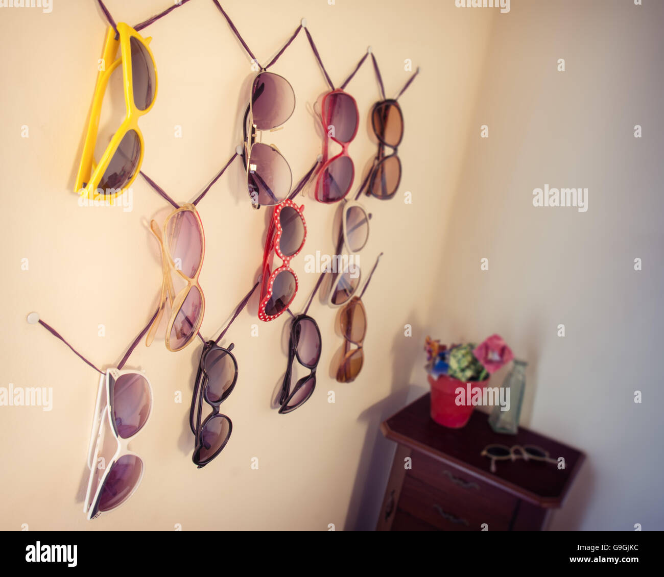 Sunglasses on a wall Stock Photo Alamy