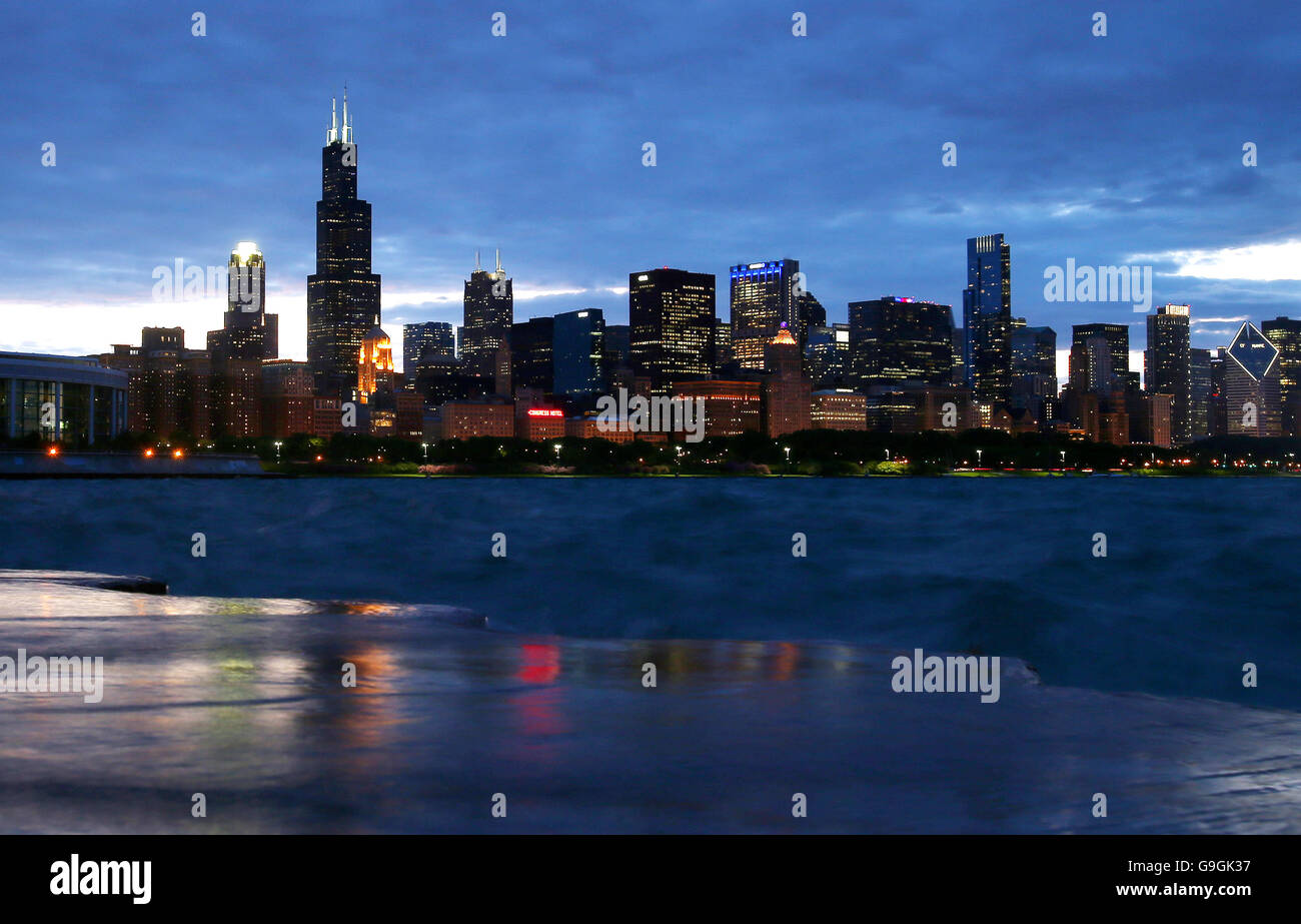 Downtown Chicago skyline along Lake Michigan at dusk including the Willis Tower as seen from the Museum Campus Stock Photo