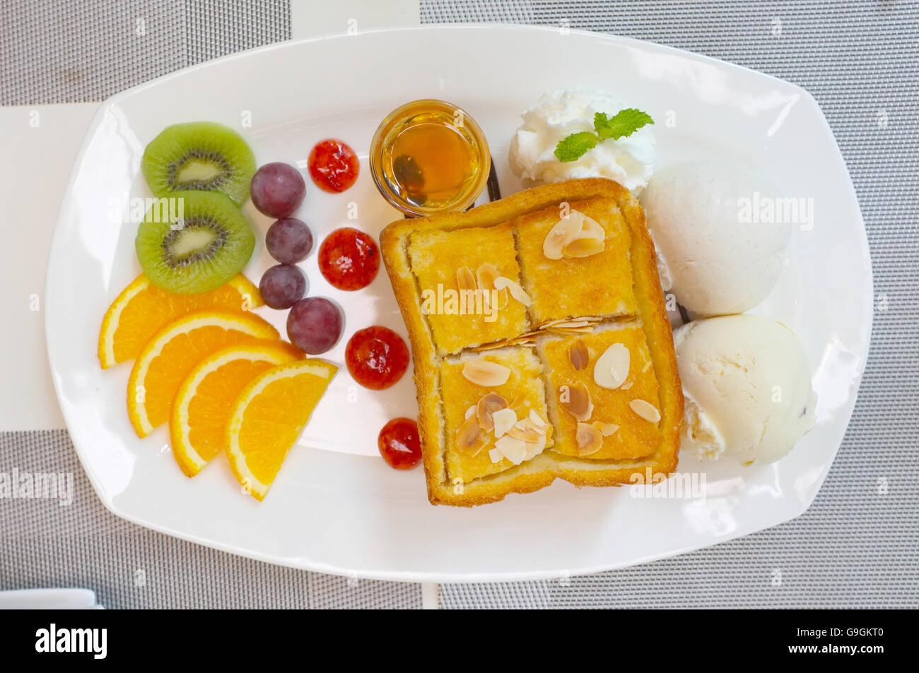 Honey toast with mixed fruit and icecream Stock Photo