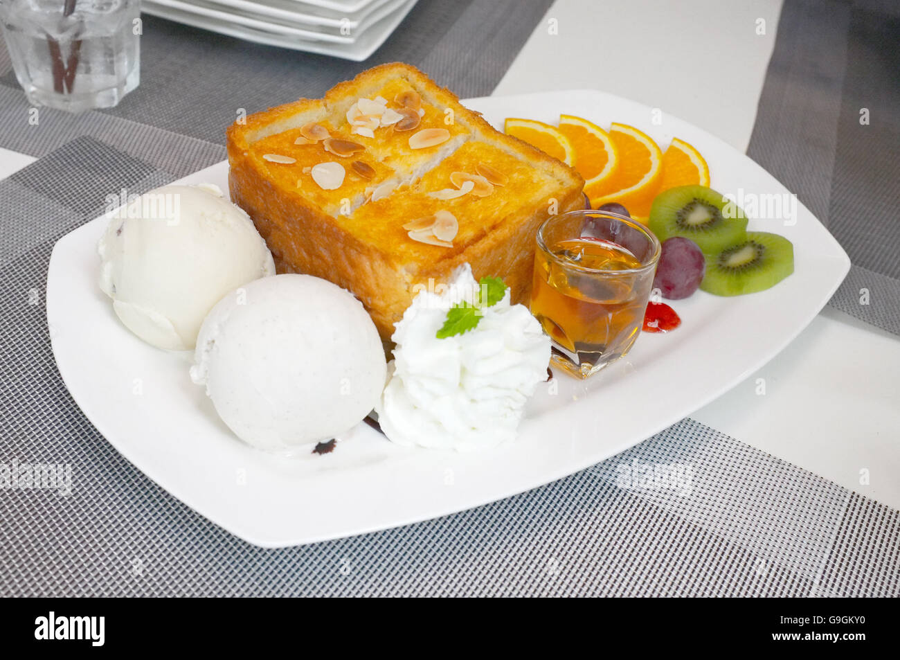 Honey toast with mixed fruit and icecream Stock Photo