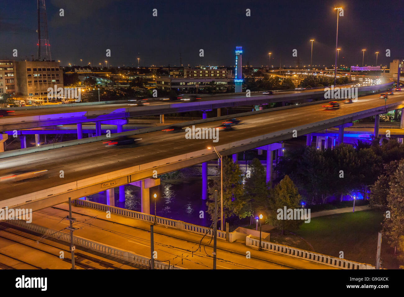 light from cars streaking on Interstate 45 through Houston at night