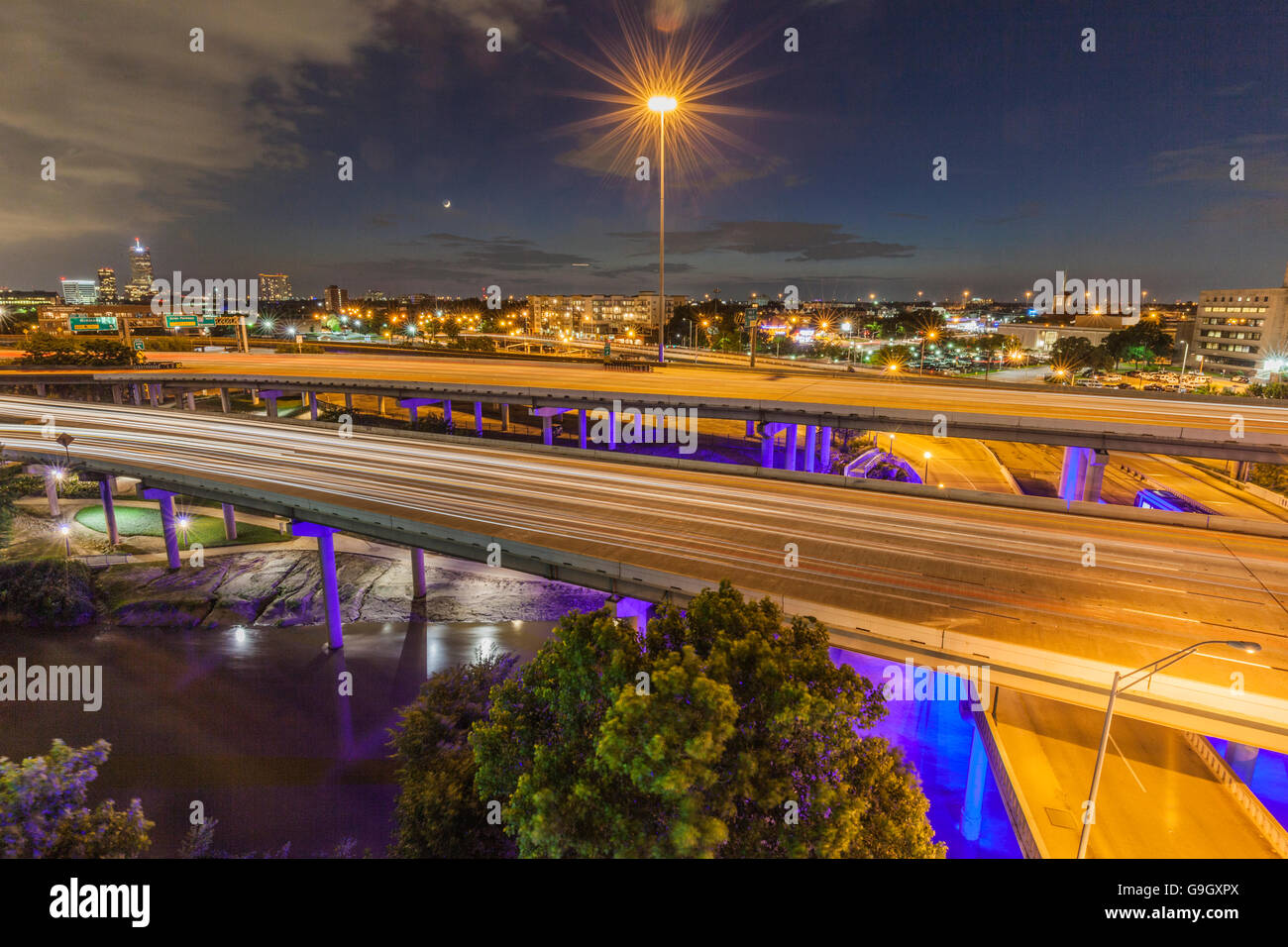 light from cars streaking on Interstate 45 through Houston at night