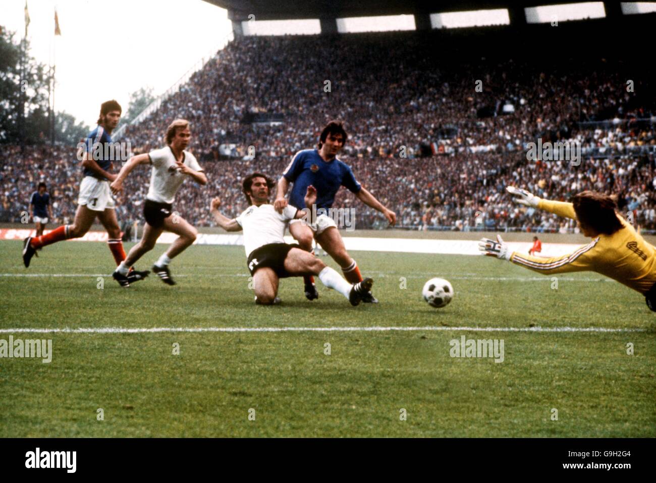 West Germany's Gerd Muller (c) beats Yugoslavia's Josip Katalinski (second r) to the ball to score the second goal past goalkeeper Enver Maric (r) Stock Photo
