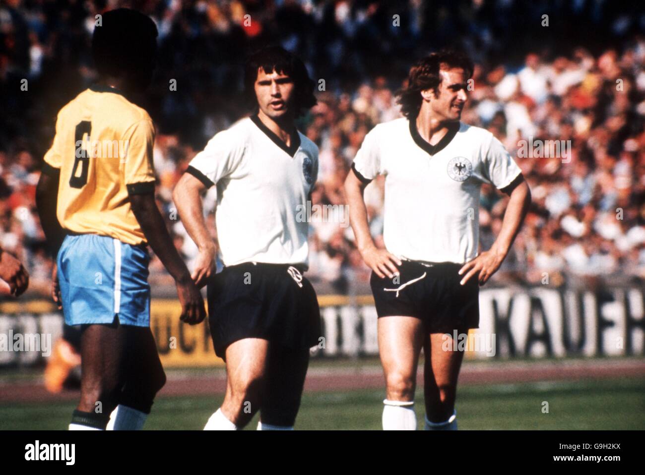 West Germany's Gerd Muller (c) and Wolfgang Overath (r) keep an eye on Brazil's Antonio (l) Stock Photo