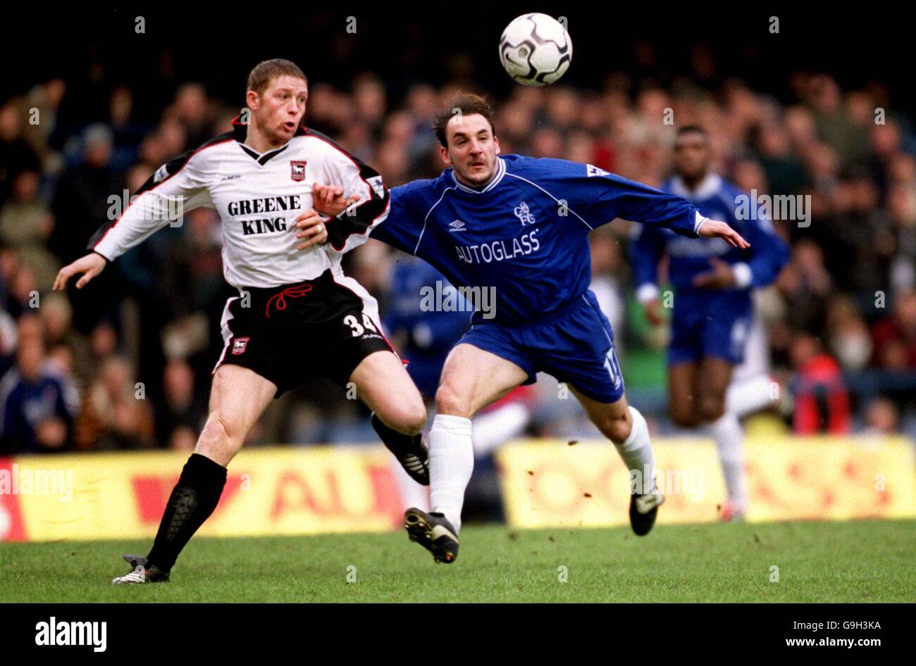 Ipswich Town's Alun Armstrong (l) and Chelsea's Albert Ferrer (r) battle for the ball Stock Photo