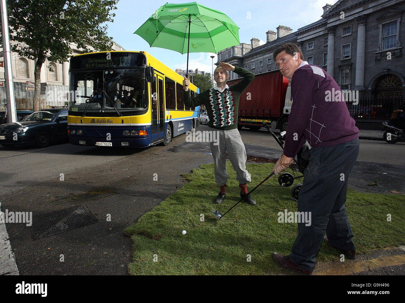 Green party TD's Eamon Ryan (right) and Ciaran Cuffe reclaim a corner of College Green, in front of Trinity College, Dublin, to mark European Car Free Day and highlight the Government's lack of any official participation in the day. Stock Photo