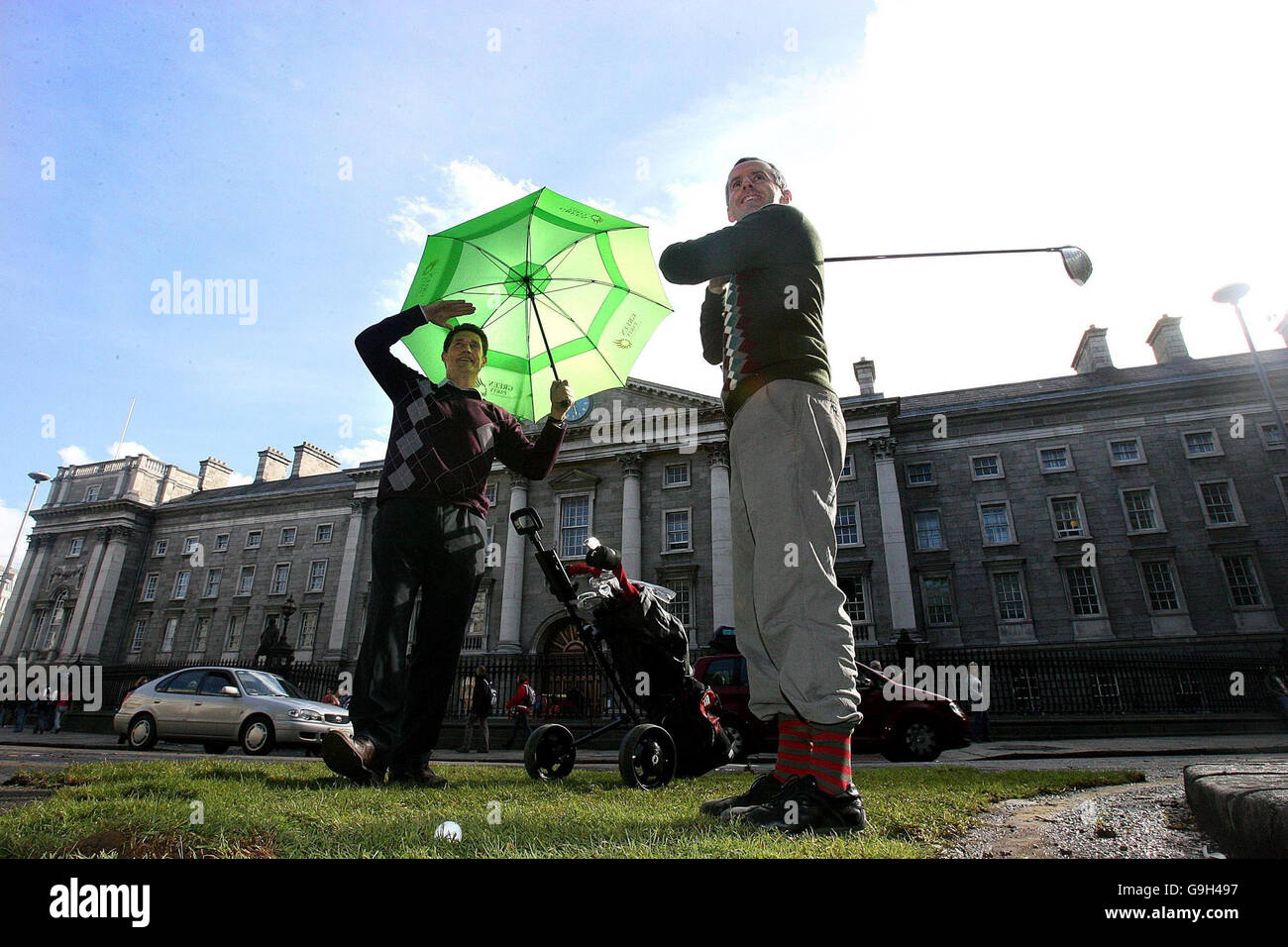 Green party TD's Eamon Ryan (left) and Ciaran Cuffe reclaim a corner of College Green, in front of Trinity College, Dublin, to mark European Car Free Day and highlight the Government's lack of any official participation in the day. Stock Photo