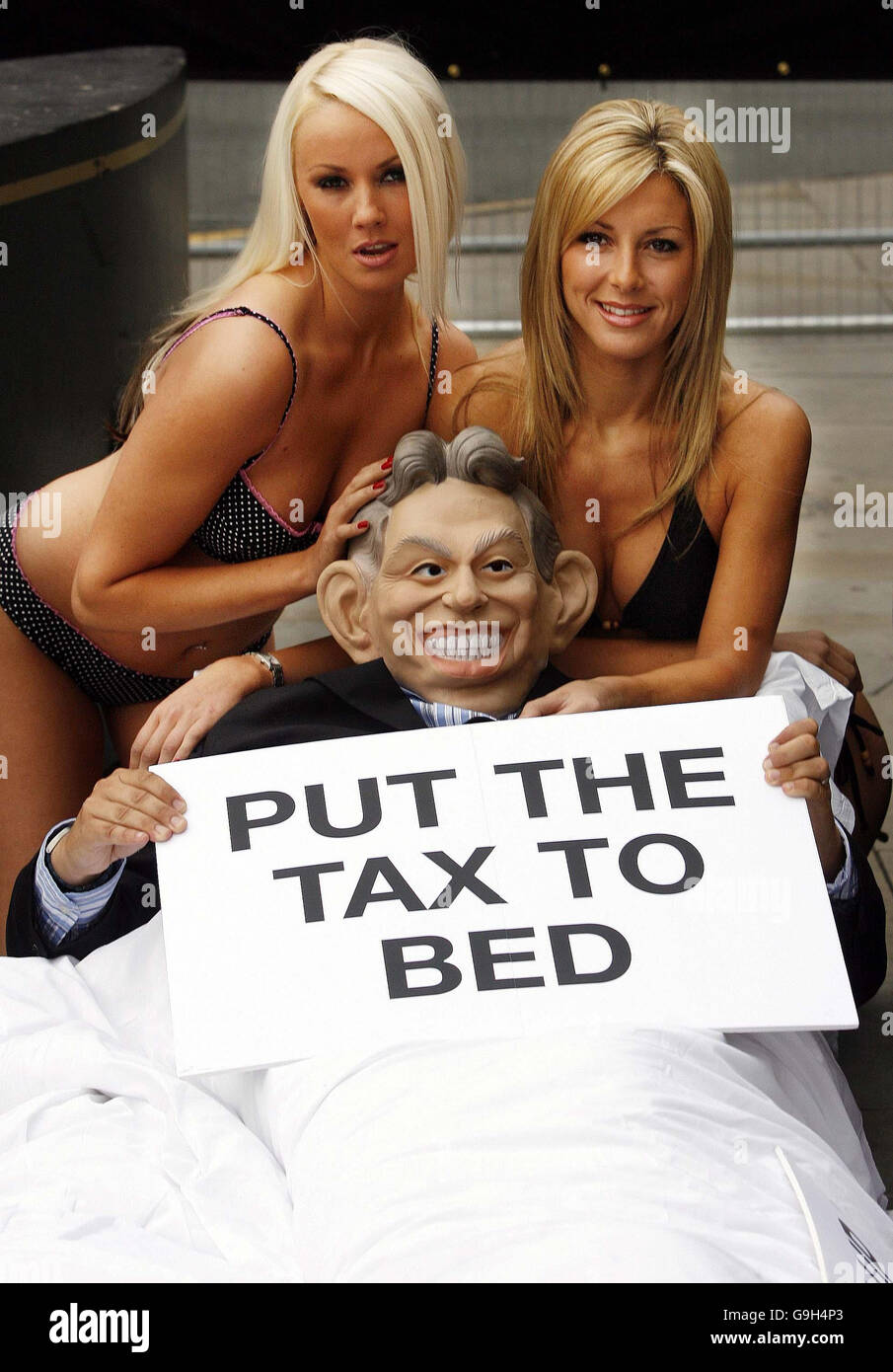Sarah Whitefoot and Karen McKay hold a 'bed tax' protest near to the Labour Party Conference at the GMEX Centre in Manchester. Stock Photo