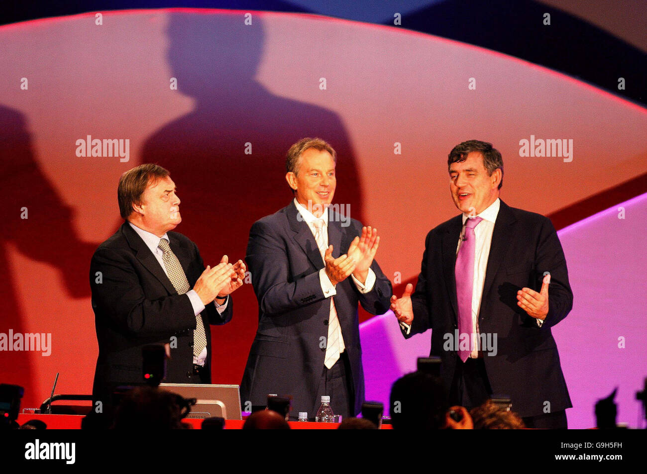 Prime Minister Tony Blair and deputy John Prescott congratulate Chancellor Gordon Brown after his speech to the Labour Party conference in Manchester. Stock Photo