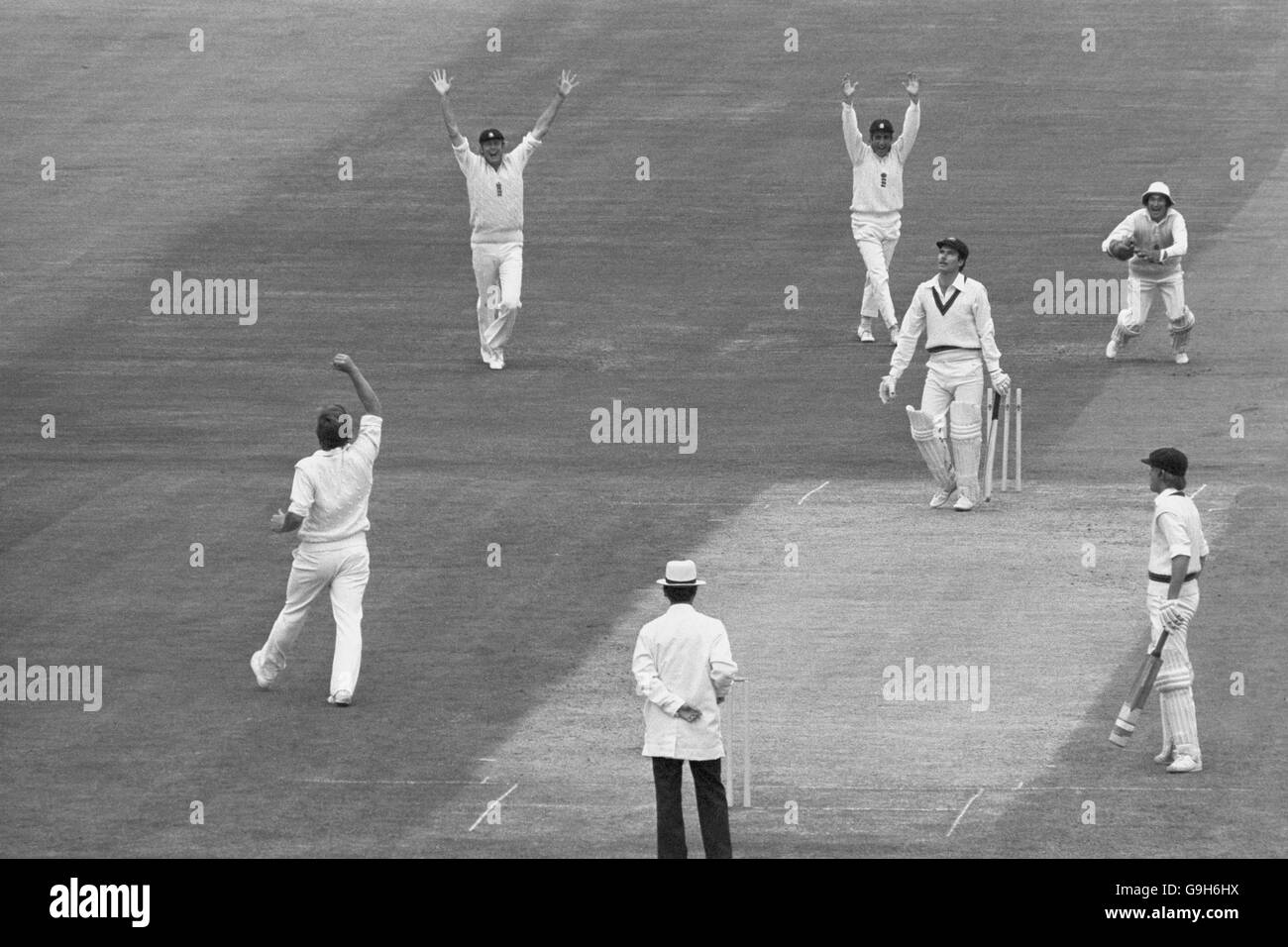 England's Ian Botham (l) celebrates taking his first test wicket with the dismissal of Australia's Greg Chappell (third r) for 19, to the delight of teammates Tony Greig (second l), Mike Brearley (fourth r) and Alan Knott (top r) Stock Photo