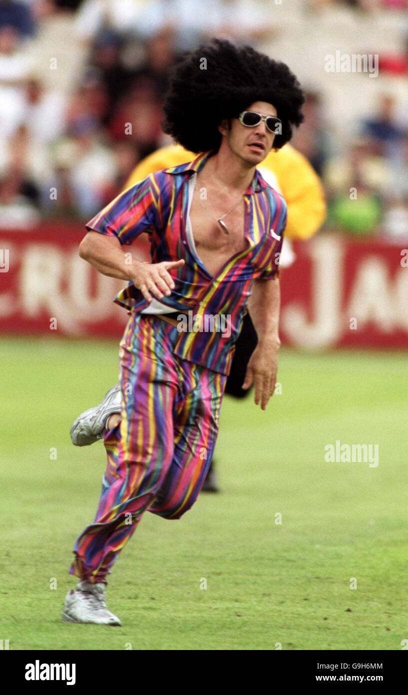 Cricket - Third Cornhill Insurance Test - England v West Indies - Third Day. A fan invades the pitch wearing a rainbow suit and a rasta man wig Stock Photo