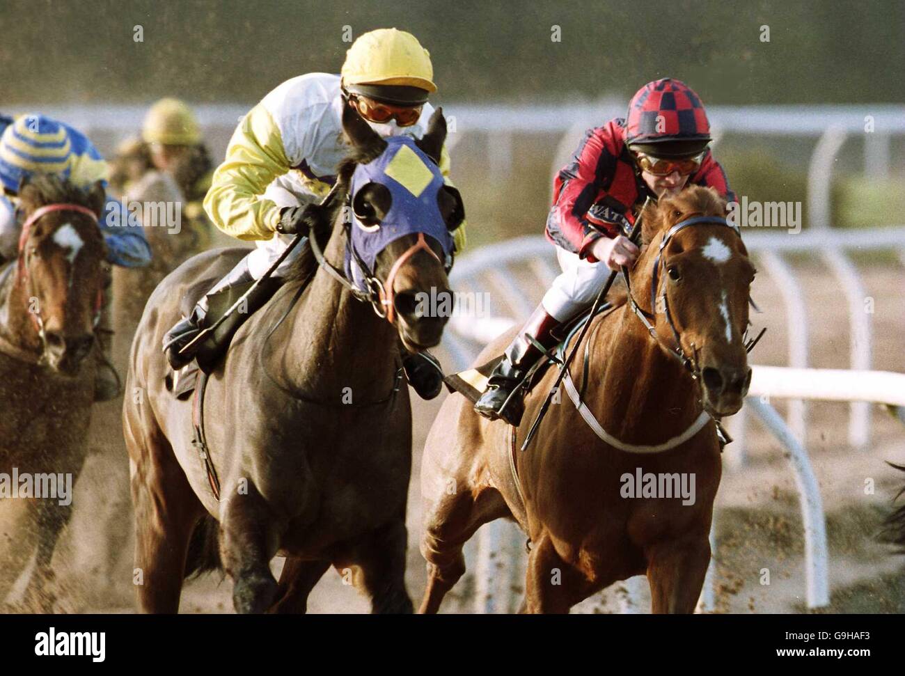 Dean Mernagh, riding Carrie Pooter (l), shakes off the challenge of Dane O'Neill on Branston Pickle to win the Thomas 'Fats' Waller Stakes at Wolverhampton Stock Photo