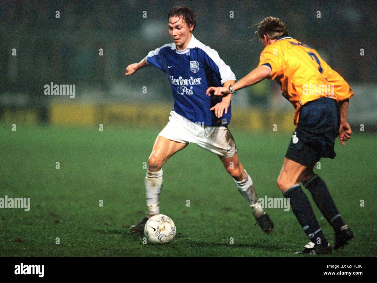 VfL Osnabruck's Dennis Weiland (l) takes on MSV Duisburg's Thomas Hoersen (r) Stock Photo