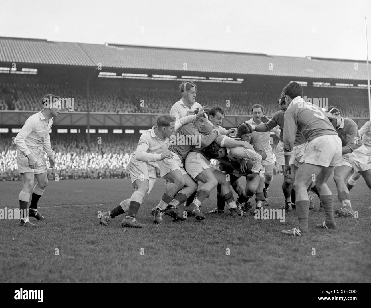 England's Gordon Bendon (c, with ball) is tackled by (l-r) France's Aldo Quaglio, Robert Vigier and Bernard Mommejat as teammate Peter Jackson (far l) looks on Stock Photo