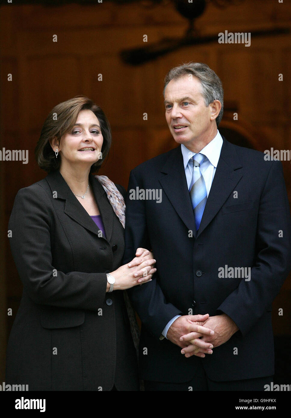 British Prime Minister Tony Blair and his wife Cherie Blair wait for