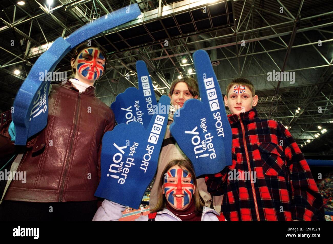 Athletics - Norwich Union Indoor Trials & AA Championships. Children with Union Jacks painted on their faces and BBC Sport foam hands Stock Photo