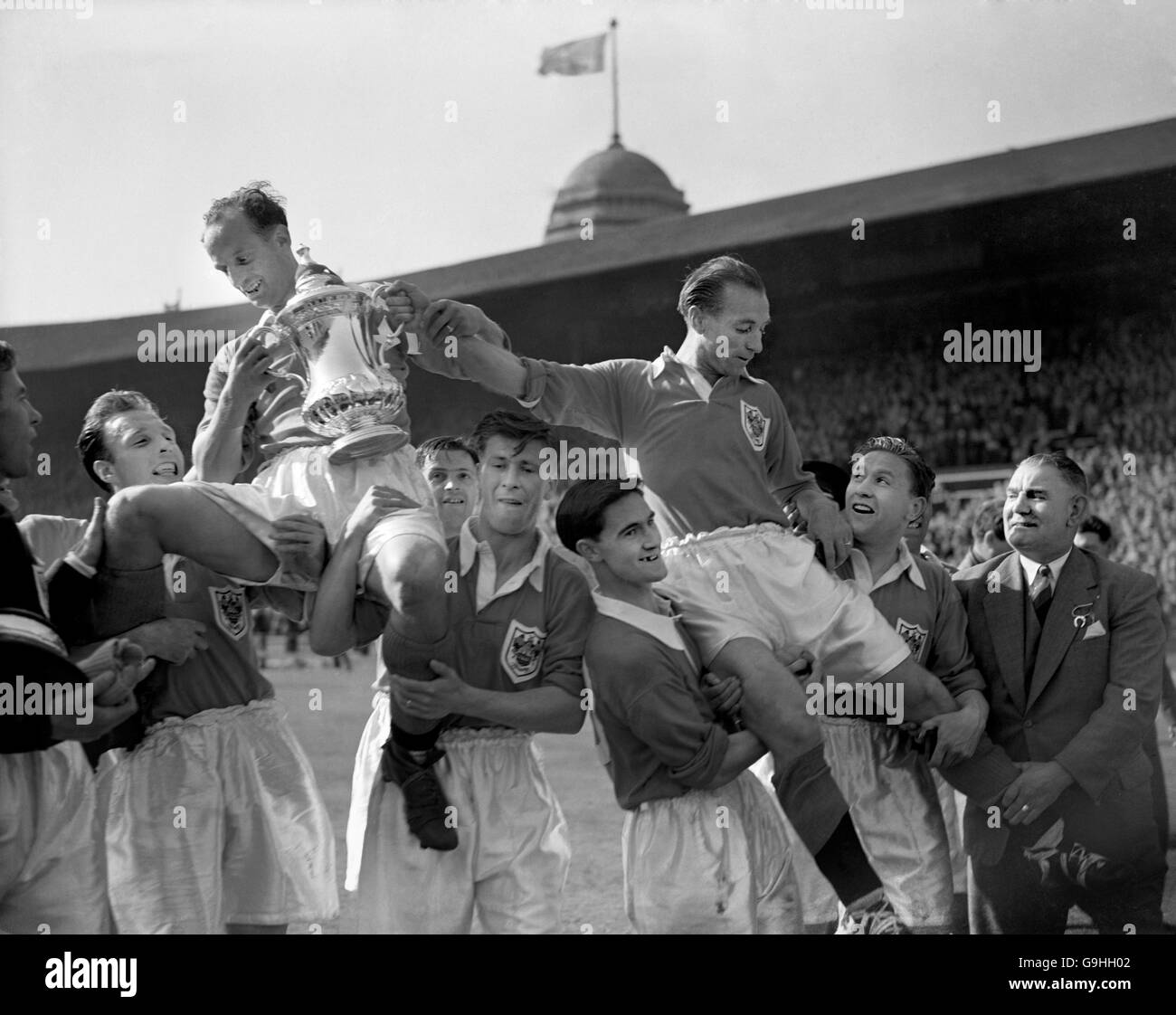 Blackpool captain Harry Johnston (top, l) holds the FA Cup aloft after his team came back from 3-1 down to win 4-3, thanks to inspired performances from Stanley Matthews (top, r), hat trick hero Stan Mortensen (r) and winning goalscorer Bill Perry (third l) Stock Photo