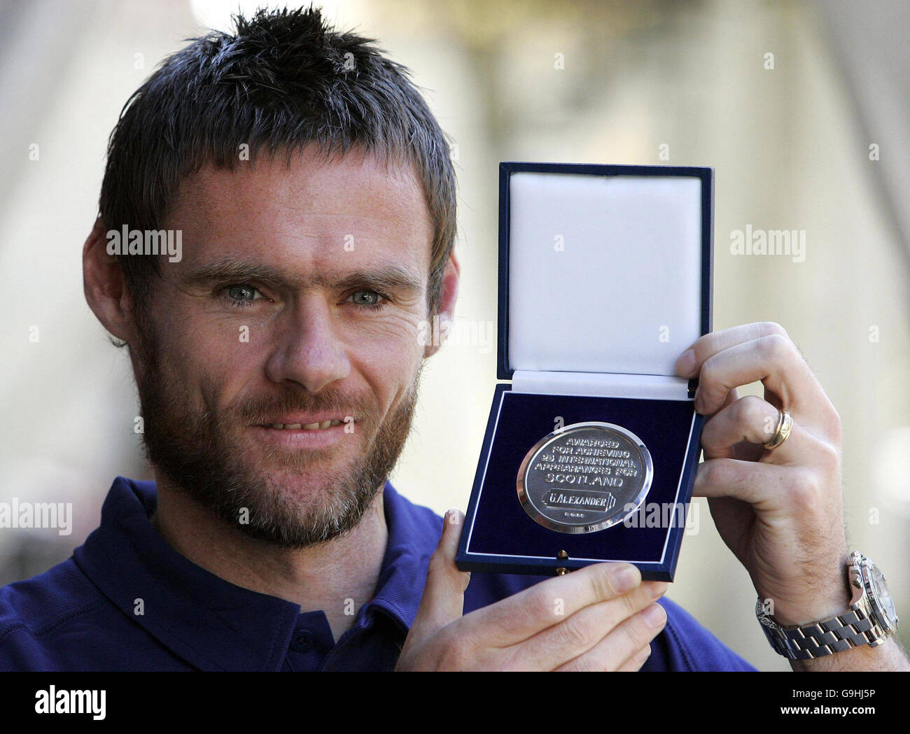 Scotland's Graham Alexander with a medal after winning his 25th cap