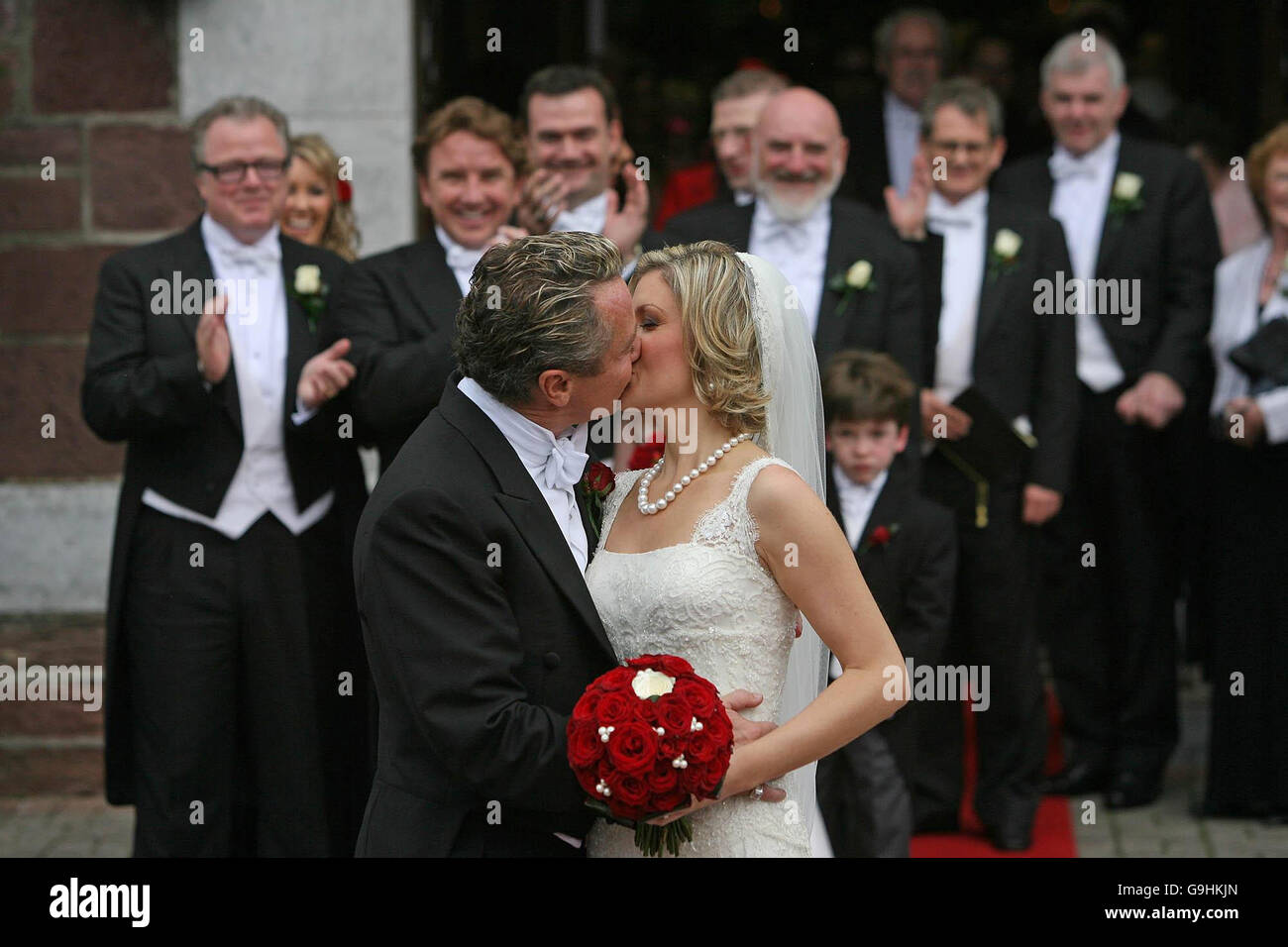 River Dance star Michael Flatley kisses his wife Niamh O'Brien as the couple leave St Patrick's church in Fermoy, Co Cork, after their wedding today. Stock Photo