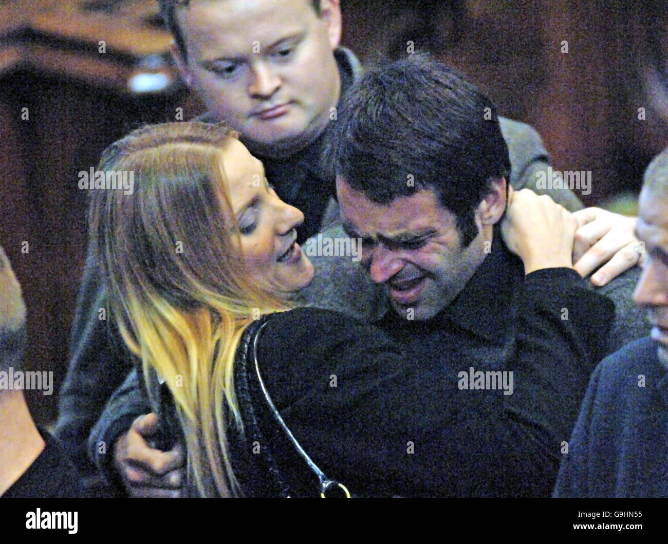 A tearful Ronnie O'Sullivan is comforted by Shuan Murphy (back) and an