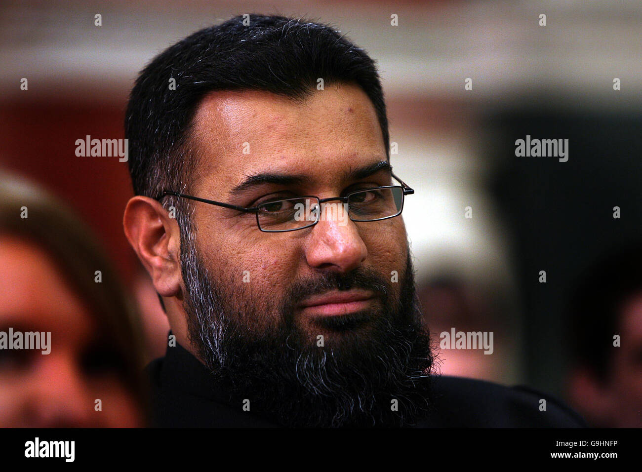 Controversial Islamic activist Anjem Choudray listens at the Trinity College Philosophical Society Debate. The flag of Islam should be flown over Leinster House, the Islamic extremist said tonight. Stock Photo