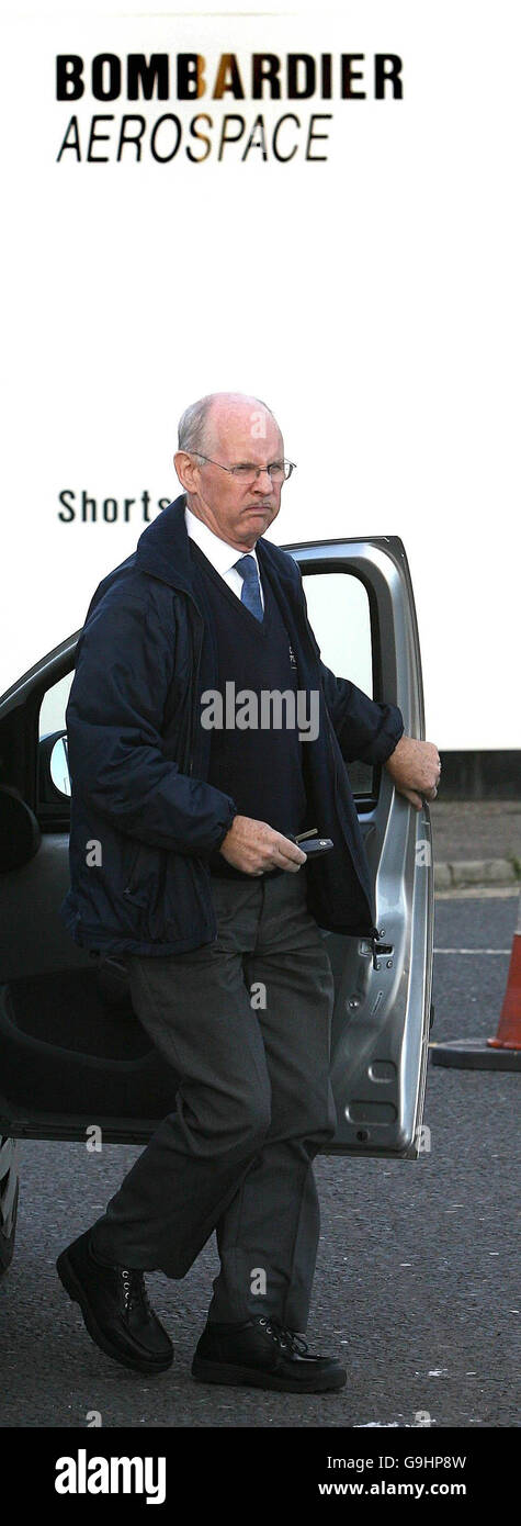 Belfast job cuts at Shorts Factory. A worker leaves the Shorts Bombardier factory in Belfast as the company announces almost 650 job losses. Stock Photo