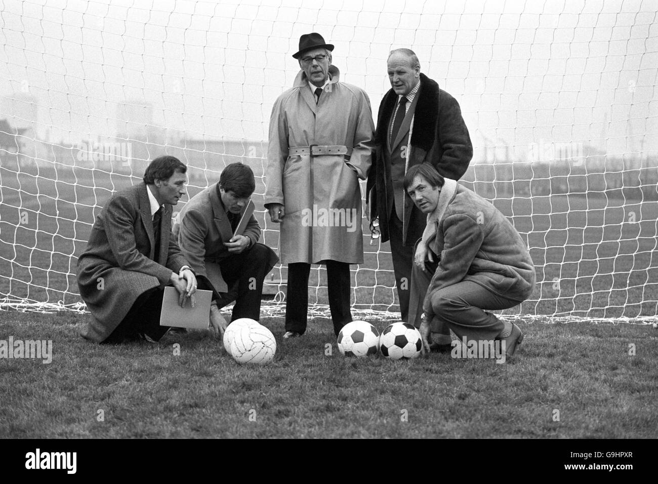 (L-R) Arsenal manager Terry Neill, Fulham manager Malcolm MacDonald, Denis Thatcher, England manager Ron Greenwood and Tottenham Hotspur manager Keith Burkinshaw inspect the new all-weather playing surface, featuring natural turf with a deep irrigation and drainage system, at a sports centre in London's Docklands Stock Photo