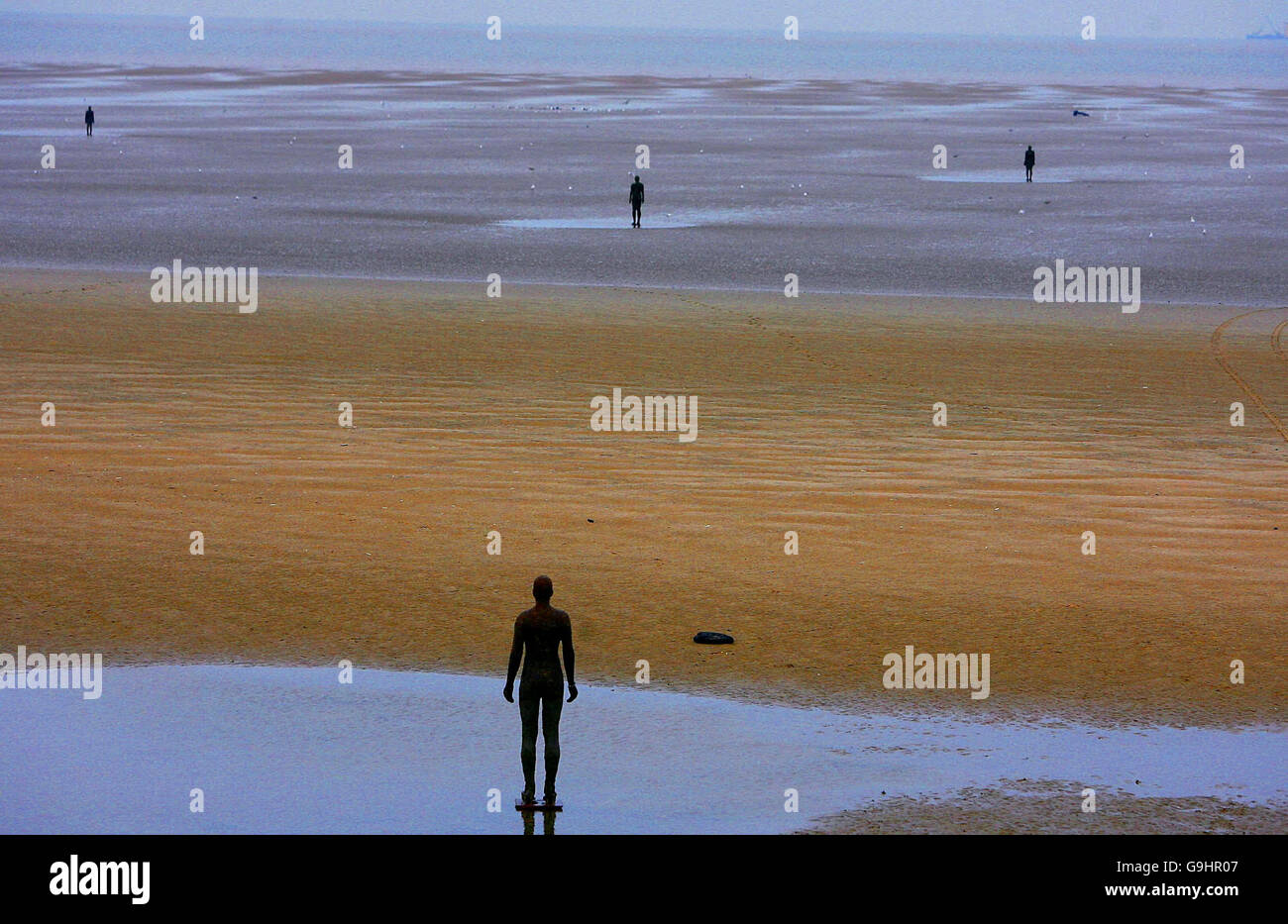 Another Place by Angel of the North creator Antony Gormley on Crosby Beach, Merseyside, that has been granted a stay of execution. Stock Photo