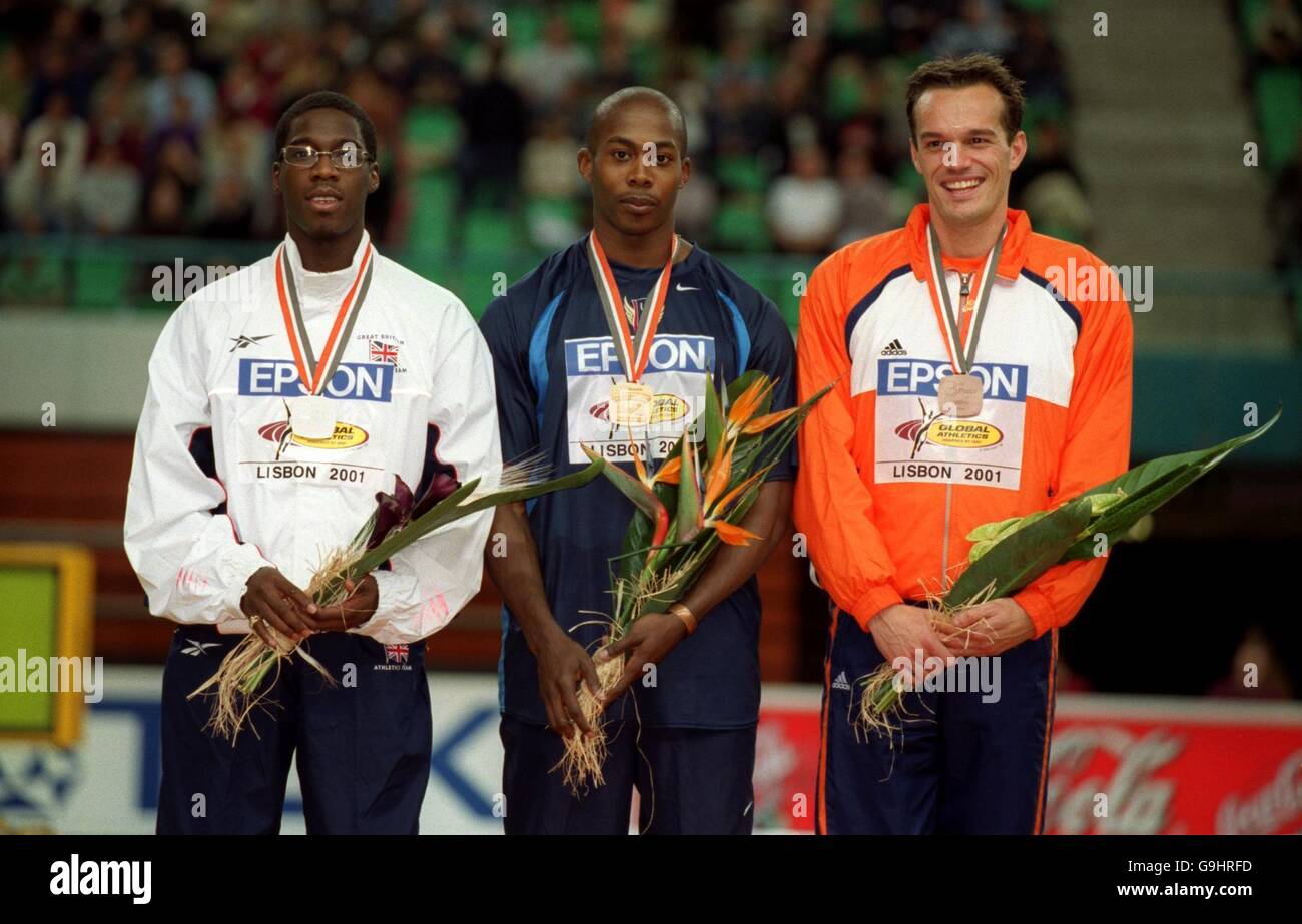 The Men's 200m medalists stand on the podium (L-R) Great Britain's Christian Malcolm (silver), USA's Shawn Crawford (gold) and Holland's Patrick Van Balkom (bronze) Stock Photo