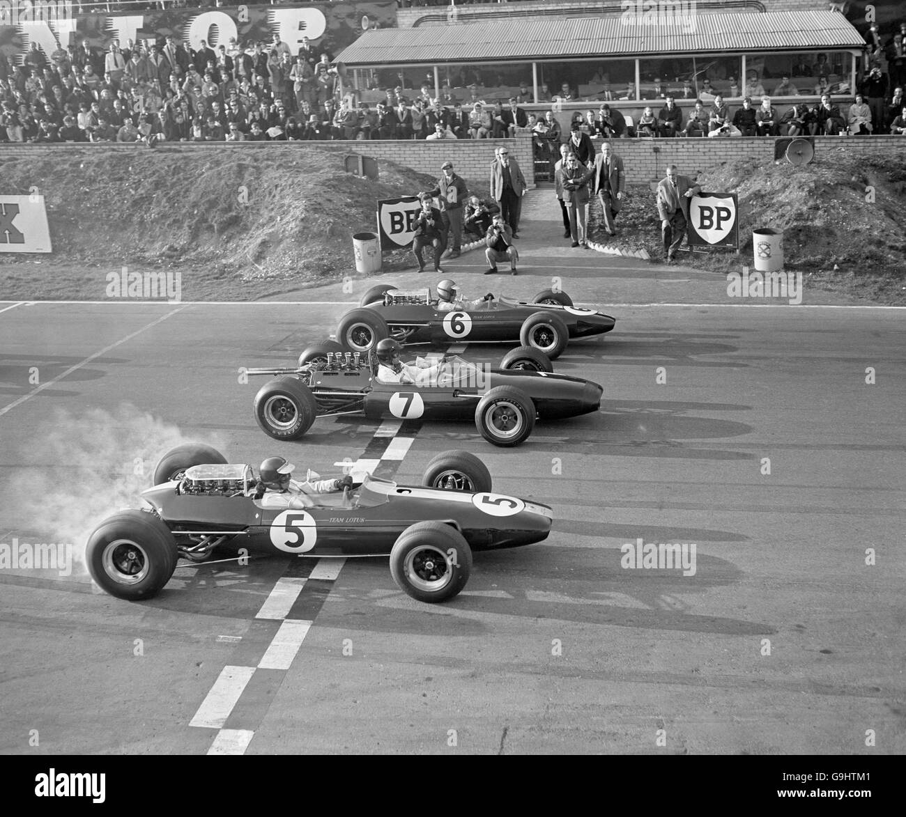 Part two of the Race of Champions gets underway, as Jim Clark (5), Dan Gurney (7) and Mike Spence (6) move off from the start Stock Photo