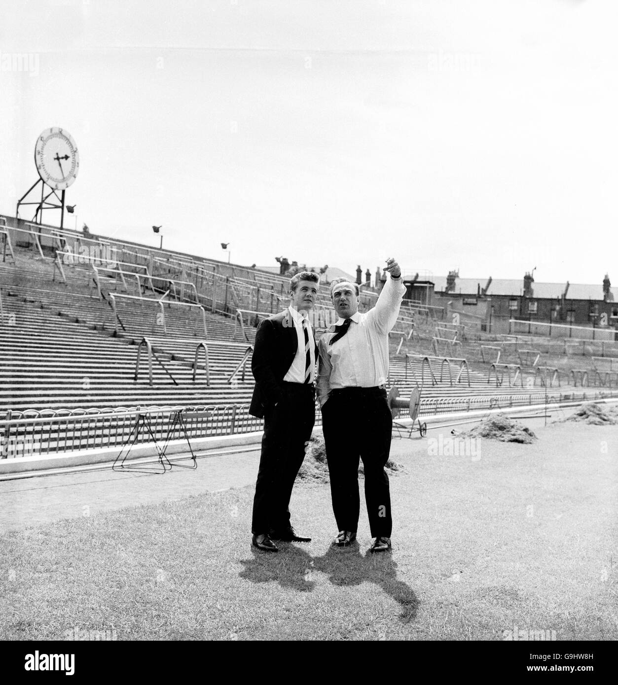 Arsenal manager Billy Wright (r) shows new signing Joe Baker (l) around Highbury as they wait for a telephone call from Baker's former club Torino to conclude the transfer Stock Photo