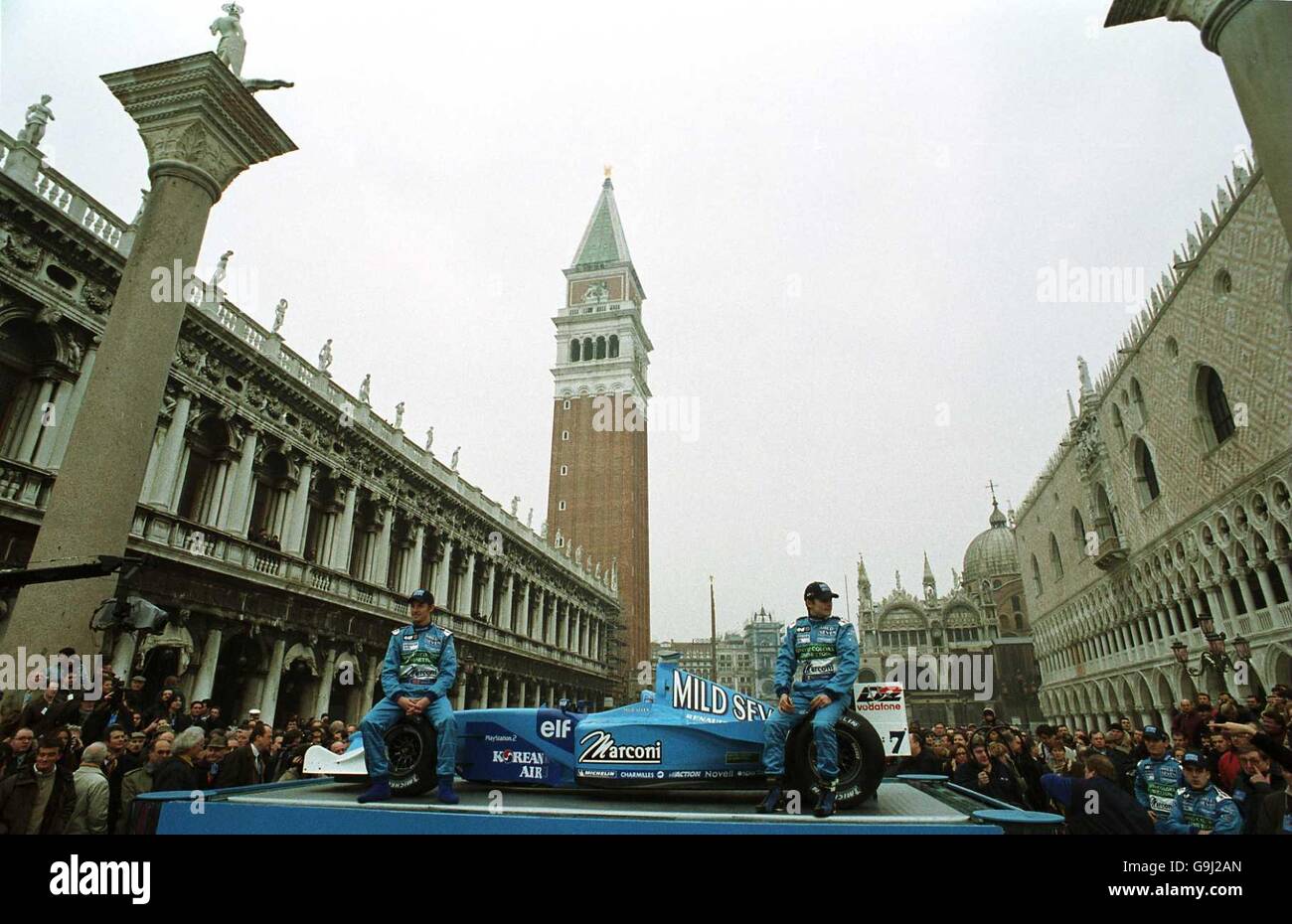 Motor Racing - Formula One - Mild Seven Benetton Renault Sport B201 car launch - Venice. L-R: Jenson Button and Giancarlo Fisichella at the launch of the Mild Seven Benetton Renault Sport B201 car in Piazza San Marco in Venice Stock Photo