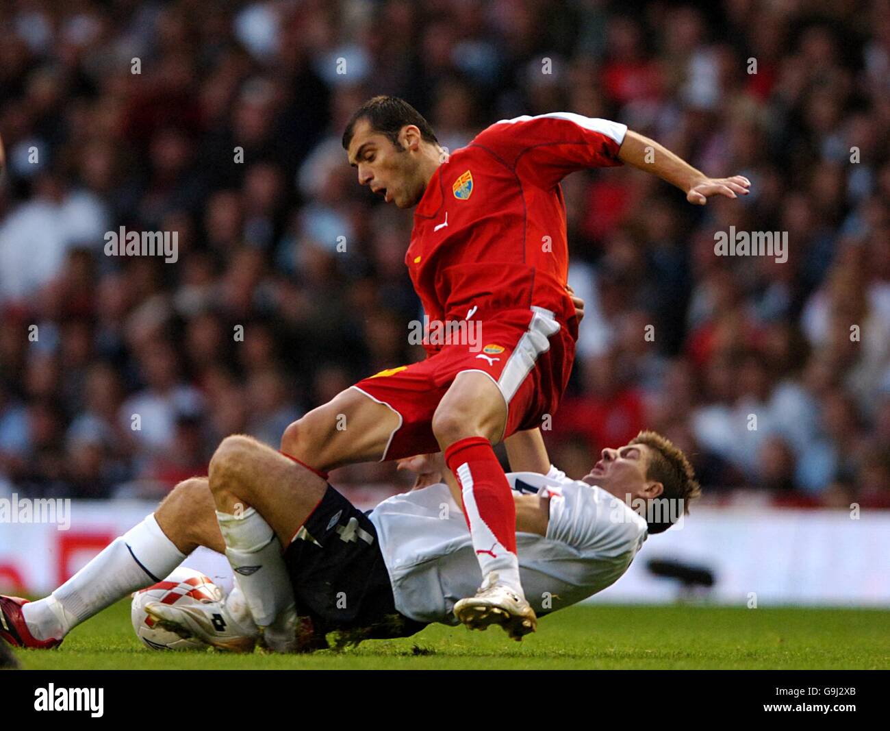 Soccer - UEFA European Championship 2008 Qualifying - Group E - England v Macedonia - Old Trafford. England's Steven Gerrard fouls Goran Pandev of FYR Macedonia resulting in a booking and missing the next game Stock Photo